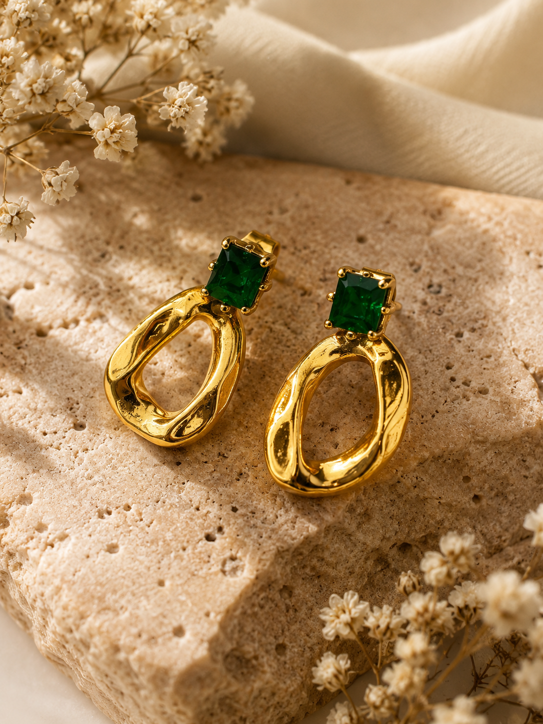 Emerald oval studs