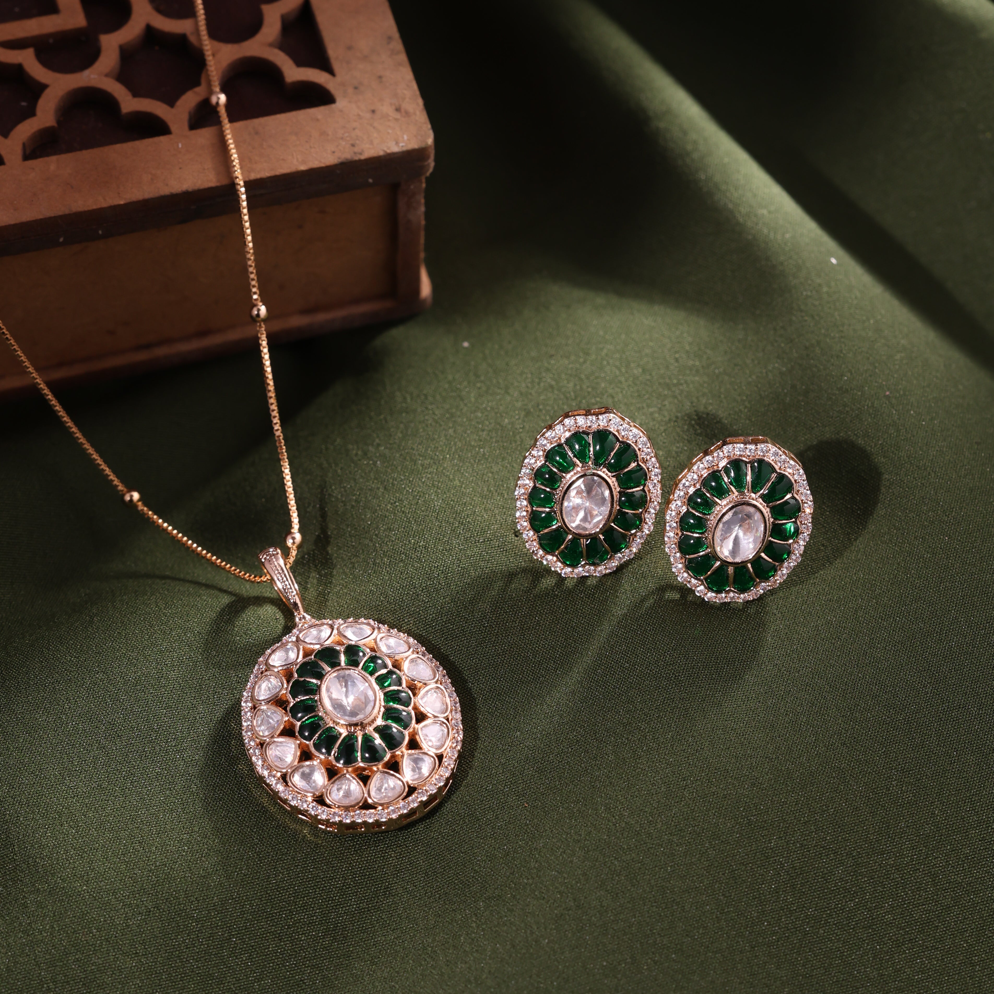 ANOKHI Emerald Kundan Rich pendant earrings set