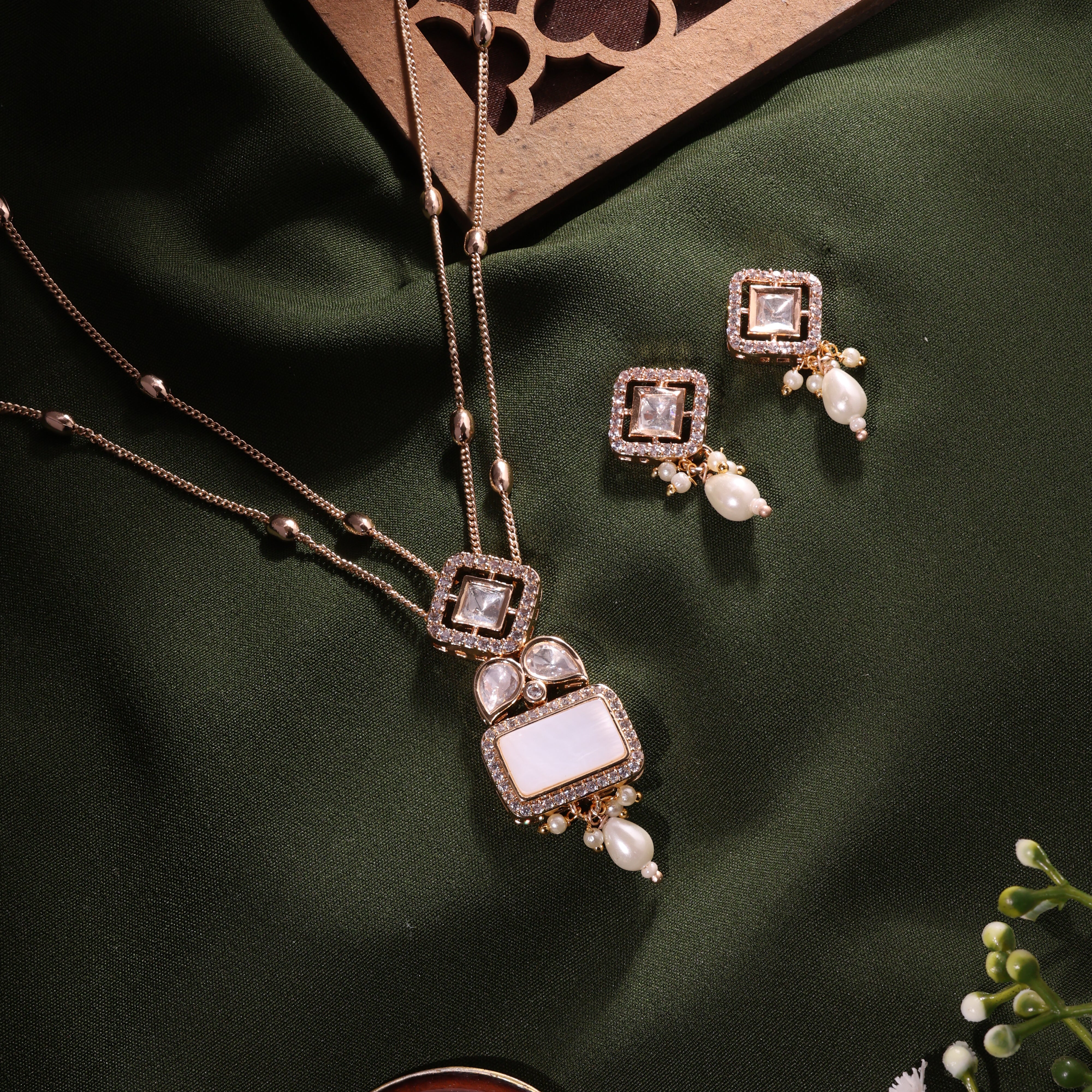 Anokhi Carved stone Kundan Pendant earrings Set